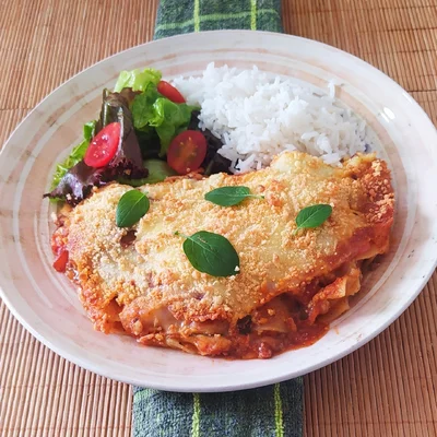 Cheese lasagna with rice and refreshing salad.