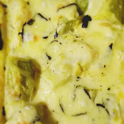 Recipe of Zucchini au gratin with parmesan cheese black cover on the DeliRec recipe website