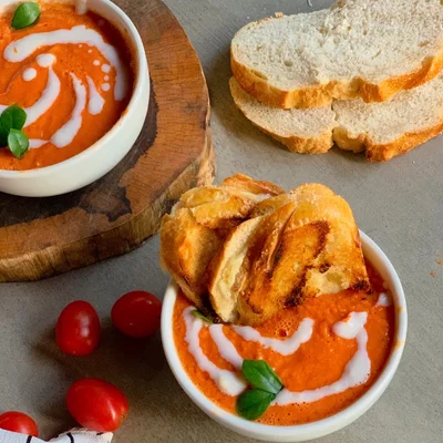 Tomato soup with hot cheese