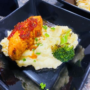 Salmon in citrus sauce with mashed potatoes