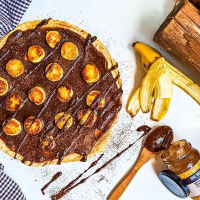 Receta de Pizza dulce de plátano y cacao en el sitio web de recetas de DeliRec