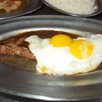 Steak with egg on top