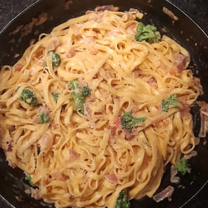 Pasta with broccoli and bacon in cream sauce