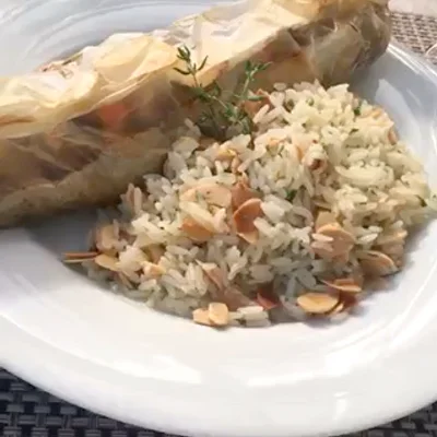 Recipe of Fish in foil with almond rice on the DeliRec recipe website